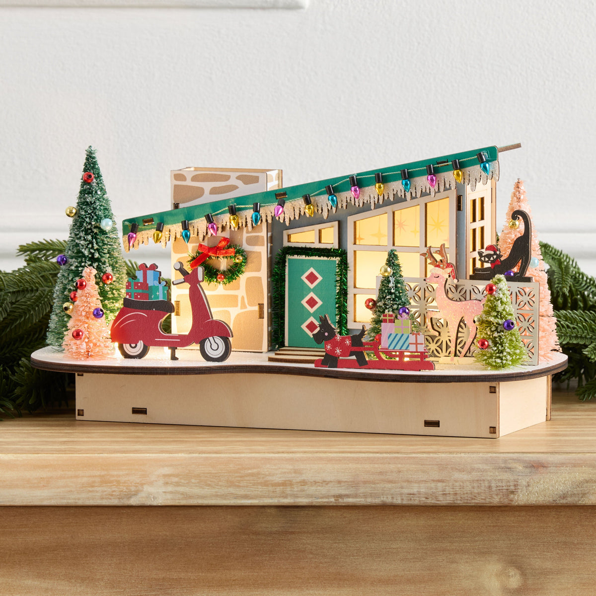 Laser Cut Wood Sloped Roof Scooter House with LED Lights and Timer for Holiday Shelves