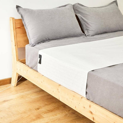 Grounding Bed Sheet with Detachable Grounding Cord and Breathable Low-Profile Fabric