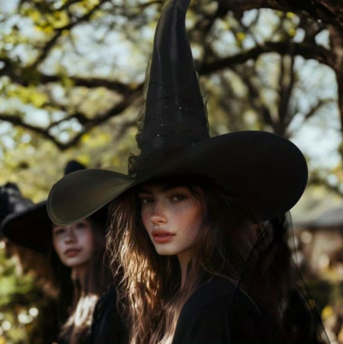 Black Witch Hat with Wide Brim, Pointed Cone, and Glitter Star Veil Drape
