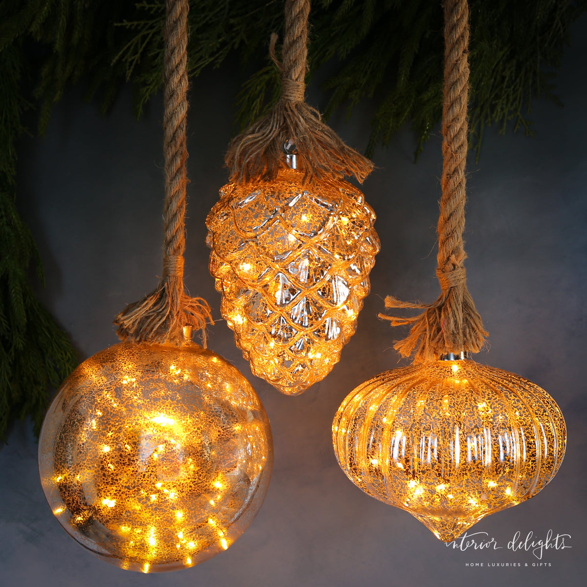 Luster Glass LED Individual Ornaments in Pinecone and Onion styles, adding a festive glow to your Christmas tree decorations.