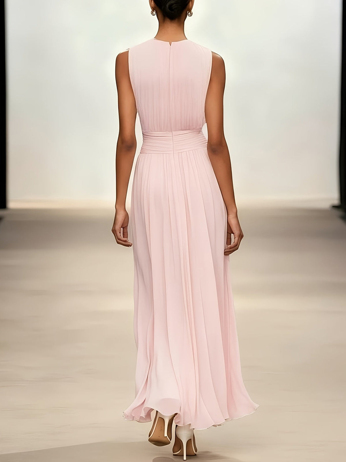 Graceful pleated wedding guest dress, maxi length, featuring a flattering ruched waist for formal elegance.