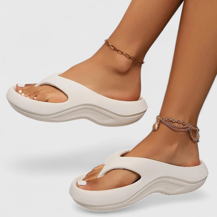 Open-toe women's wellness sandals, engineered for exceptional foot support, cloud-like comfort, and style.
